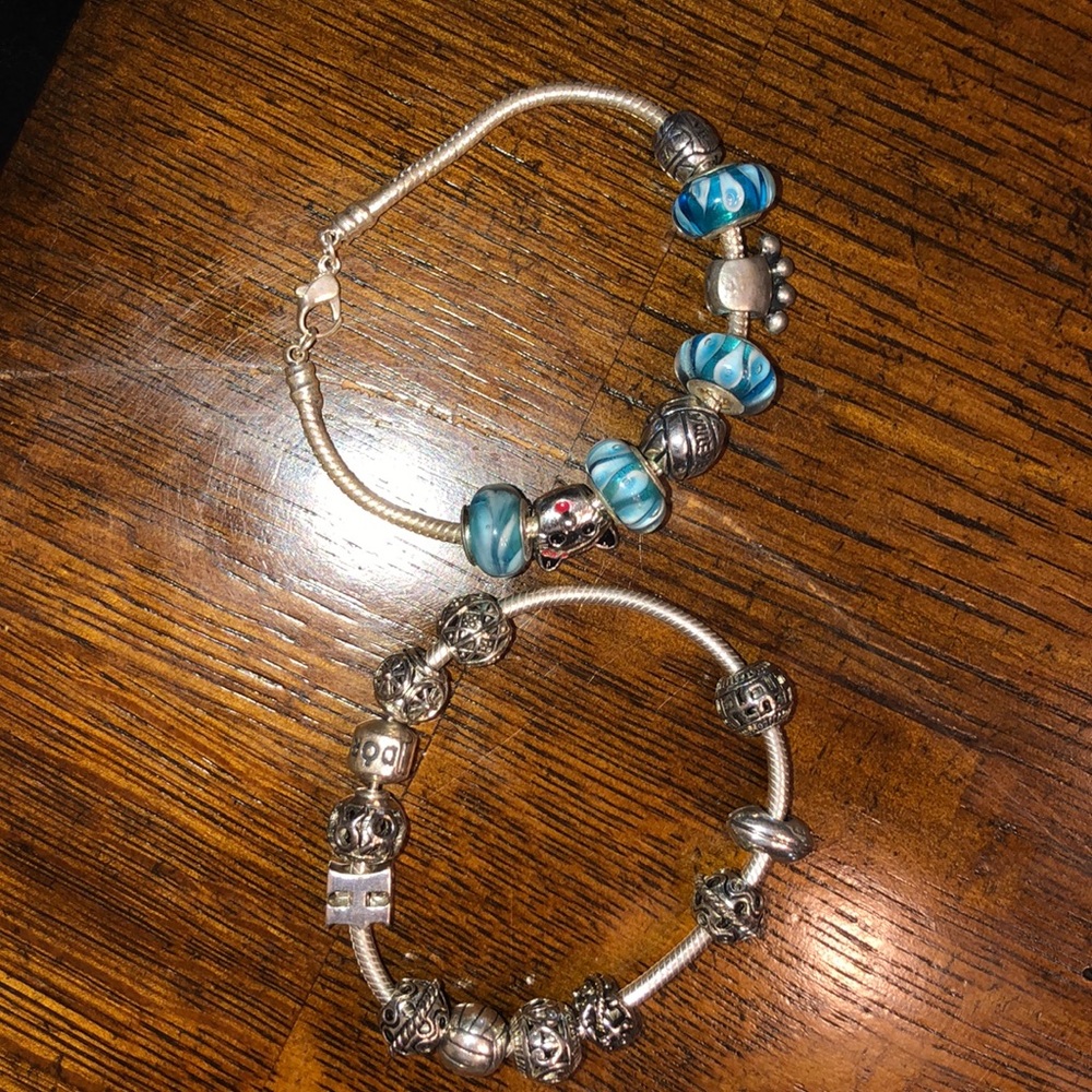 Pandora bracelets with assortment of charms